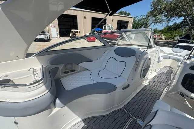 Slide: The Image of 2004 Monterey 298SS Super Sport boat interior with cushioned seating and sleek design. - 13