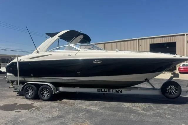 Slide: The Image of 2004 Monterey 298SS Super Sport boat on a trailer, parked outdoors. - 1