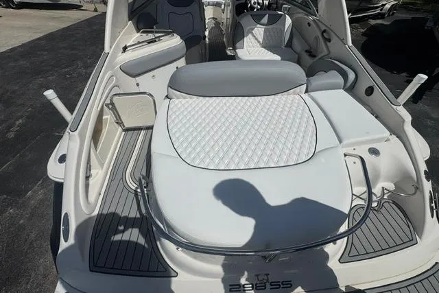 Slide: The Image of 2004 Monterey 298SS Super Sport boat interior with white quilted seating and sleek design. - 10