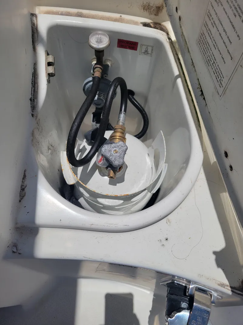 Slide: The Image of Propane tank compartment on a 2016 Jeanneau Merry Fisher 855 boat. - 40