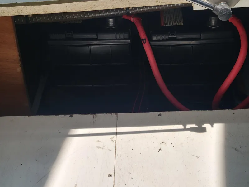 Slide: The Image of Battery compartment of 2016 Jeanneau Merry Fisher 855 with visible red cables. - 41