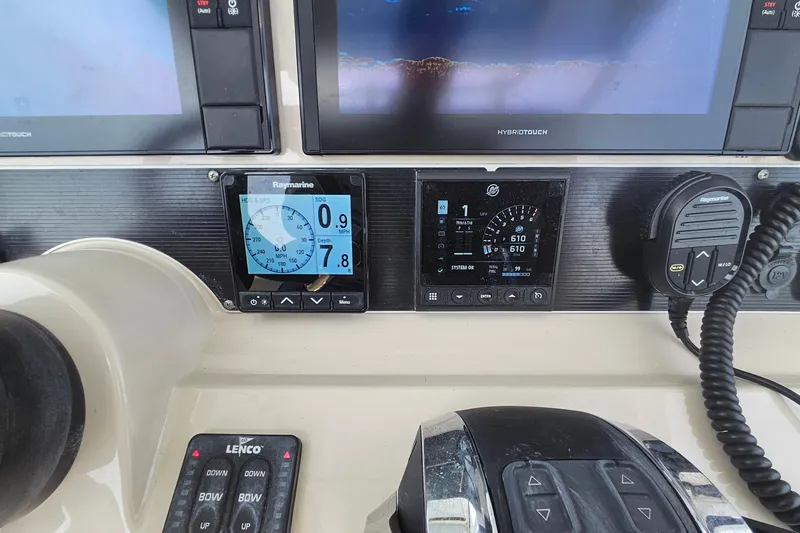 Slide: The Image of Control panel of a 2021 Boston Whaler 270 Dauntless with navigation and communication equipment. - 17