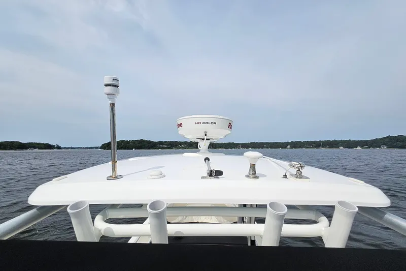 Slide: The Image of Boston Whaler 270 Dauntless 2021 boat on water, featuring radar and antenna equipment. - 28