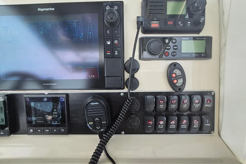 Slide: The Image of Control panel of a 2021 Boston Whaler 270 Dauntless with navigation and communication systems. - 18