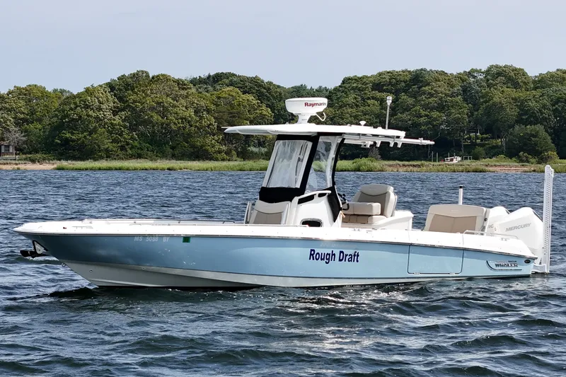 Slide: The Image of 2021 Boston Whaler 270 Dauntless boat named "Rough Draft" on a scenic lake. - 1