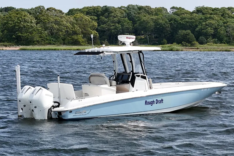 Slide: The Image of 2021 Boston Whaler 270 Dauntless boat on water, featuring twin Mercury engines. - 8