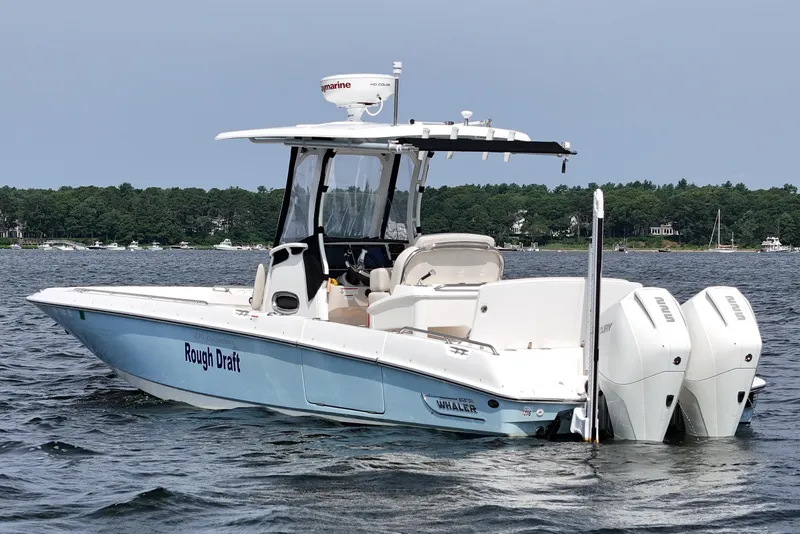 Slide: The Image of 2021 Boston Whaler 270 Dauntless boat on water, featuring twin engines and sleek design. - 5