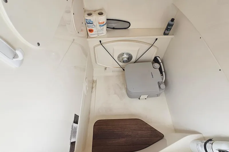 Slide: The Image of Interior of 2021 Boston Whaler 270 Dauntless boat with portable toilet and accessories. - 30