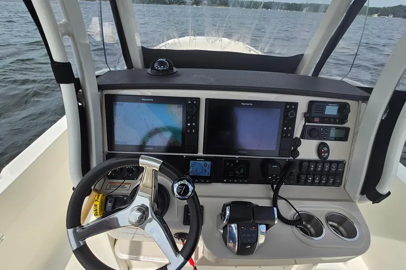 Slide: The Image of Cockpit of 2021 Boston Whaler 270 Dauntless with advanced navigation and control systems. - 16
