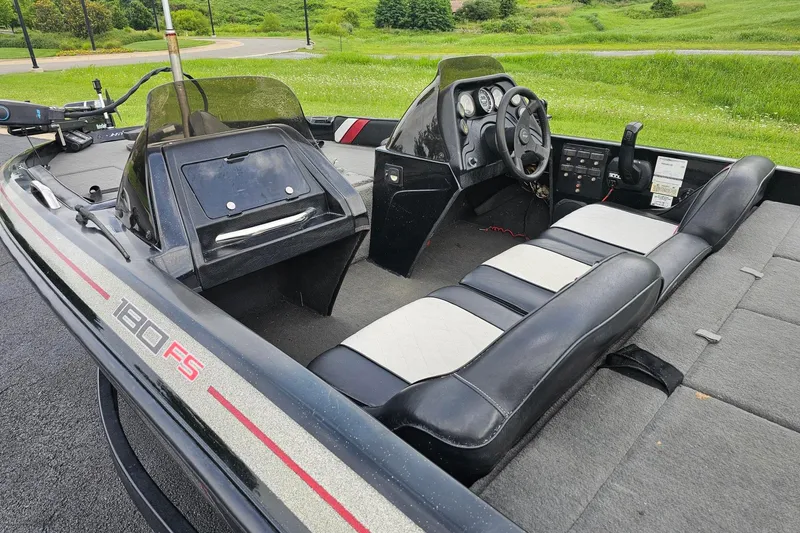 Slide: The Image of 1994 Nitro 180 FS boat interior with steering wheel, seating, and control panel. - 7