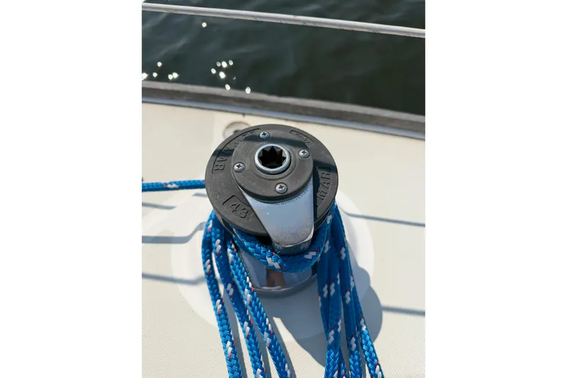 Slide: The Image of Winch with blue rope on 1986 Pearson 33 sailboat deck. - 31