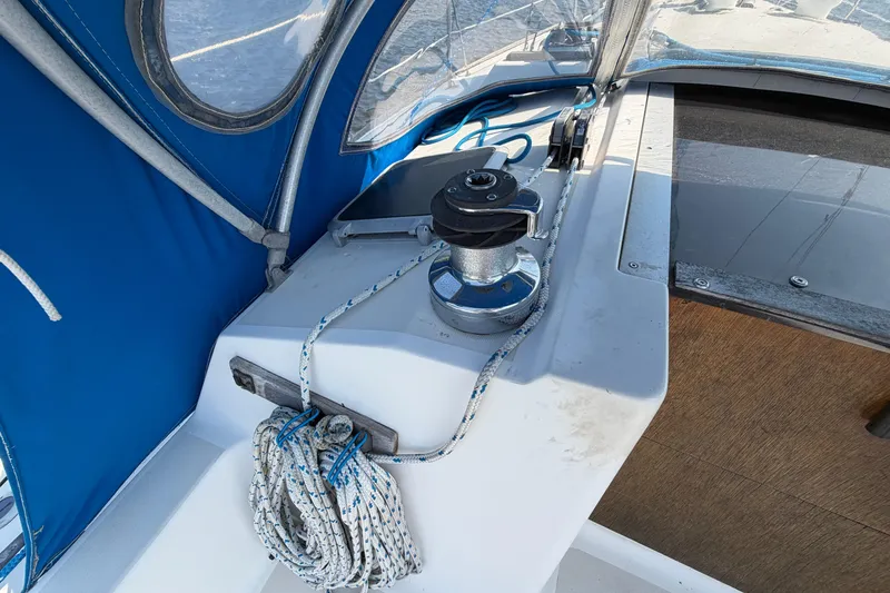 Slide: The Image of Sailboat deck with winch and ropes, Pearson 33, 1986 model, blue canopy. - 28