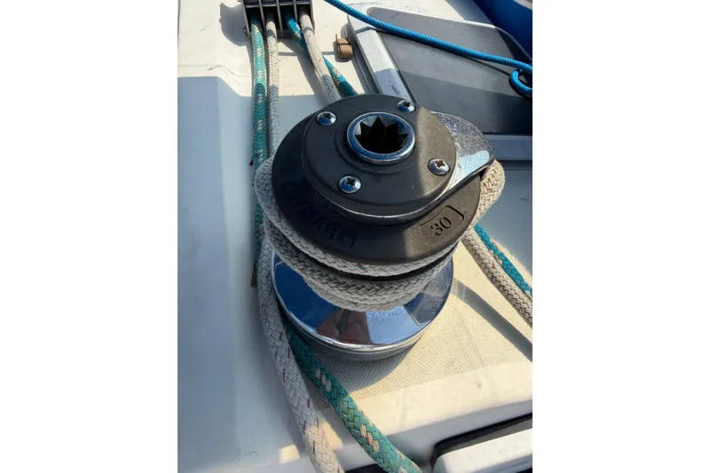 Slide: The Image of Winch on 1986 Pearson 33 sailboat deck with ropes and hardware. - 29