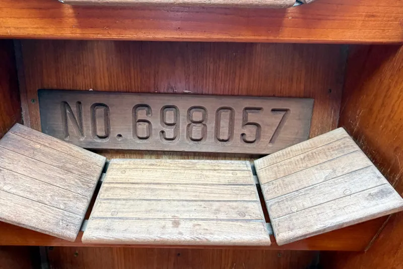 Slide: The Image of Wooden interior of 1986 Pearson 33 sailboat with registration number 698057. - 14