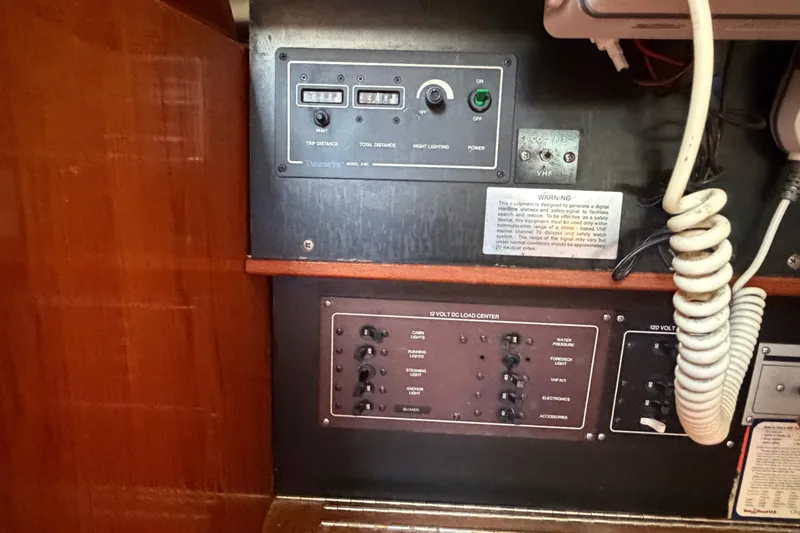 Slide: The Image of Control panel of a 1986 Pearson 33 sailboat with various switches and indicators. - 15