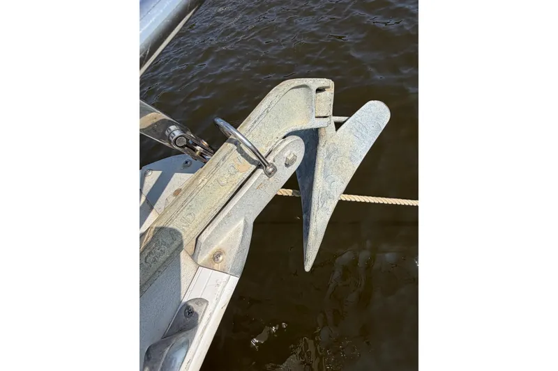 Slide: The Image of Anchor on a 1986 Pearson 33 sailboat, secured above water. - 38