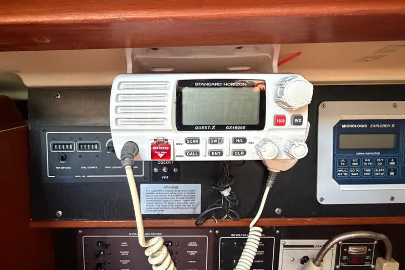 Slide: The Image of VHF radio and navigation equipment on a 1986 Pearson 33 sailboat control panel. - 16
