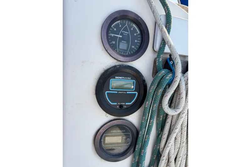 Slide: The Image of Instrumentation panel on a 1986 Pearson 33 sailboat with ropes and gauges. - 26