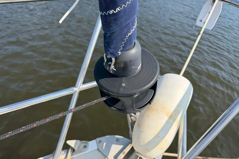 Slide: The Image of Furling system on 1986 Pearson 33 sailboat with visible rigging and water background. - 37