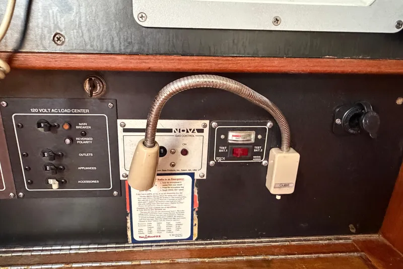Slide: The Image of Electrical panel of a 1986 Pearson 33 sailboat with various controls and indicators. - 18