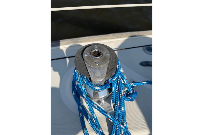 Slide: The Image of Winch with blue rope on 1986 Pearson 33 sailboat deck. - 32