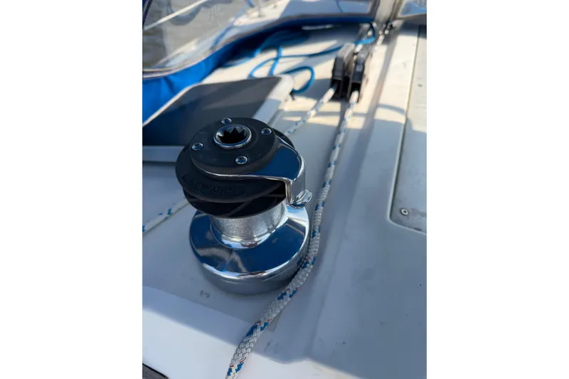Slide: The Image of Winch on 1986 Pearson 33 sailboat deck with rope and hardware. - 30