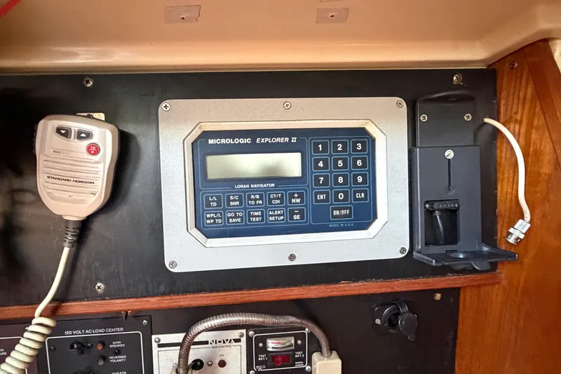 Slide: The Image of Control panel of a 1986 Pearson 33 sailboat with navigation and communication equipment. - 17