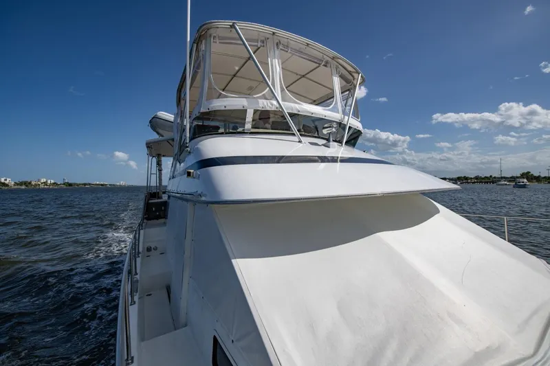 Slide: The Image of 1988 Tollycraft 44 Cockpit Motor Yacht cruising on a sunny day. - 60