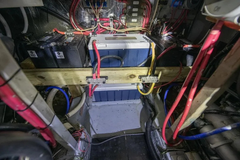 Slide: The Image of Engine room of 1988 Tollycraft 44 Cockpit Motor Yacht with batteries and wiring. - 66