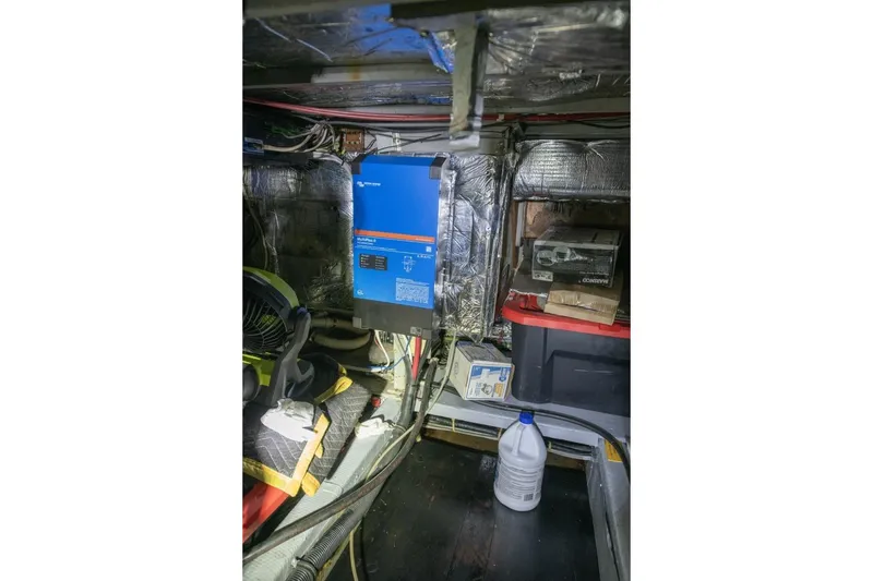Slide: The Image of Engine room of 1988 Tollycraft 44 Cockpit Motor Yacht with equipment and storage. - 67