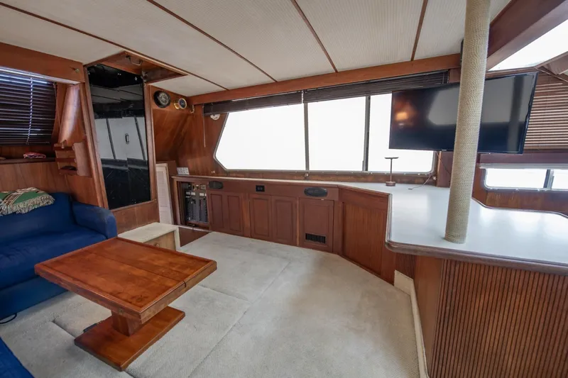 Slide: The Image of Interior of 1988 Tollycraft 44 Cockpit Motor Yacht with wood accents and modern amenities. - 18