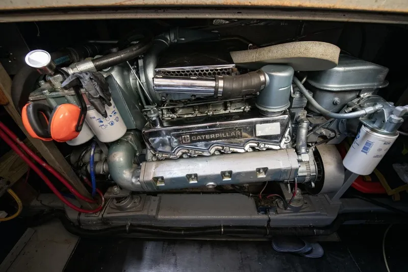 Slide: The Image of Engine compartment of a 1988 Tollycraft 44 Cockpit Motor Yacht featuring a Caterpillar engine. - 64
