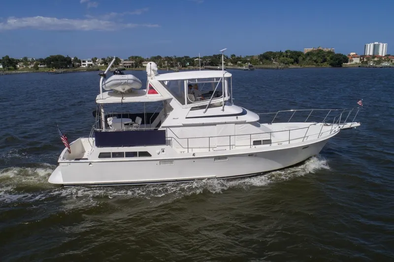Slide: The Image of 1988 Tollycraft 44 Cockpit Motor Yacht cruising on a sunny day. - 2