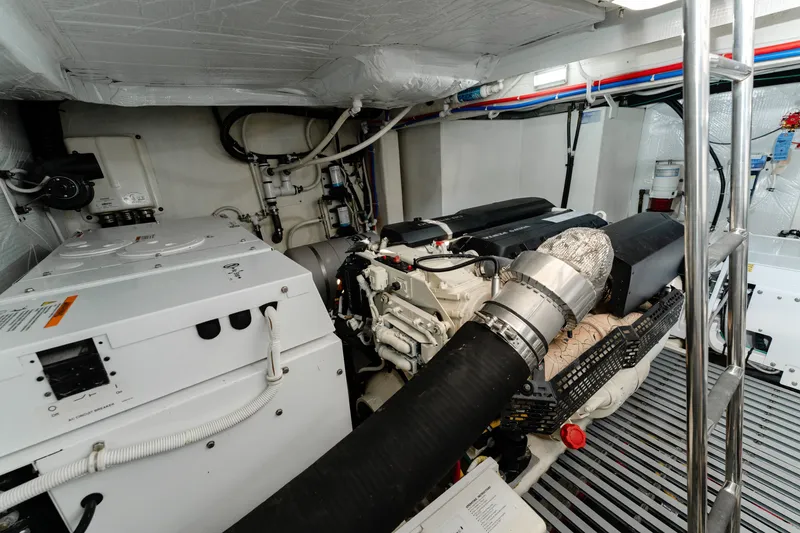 Slide: The Image of Engine room of 2020 Tiara Yachts C49 Coupe, showcasing advanced marine machinery. - 44