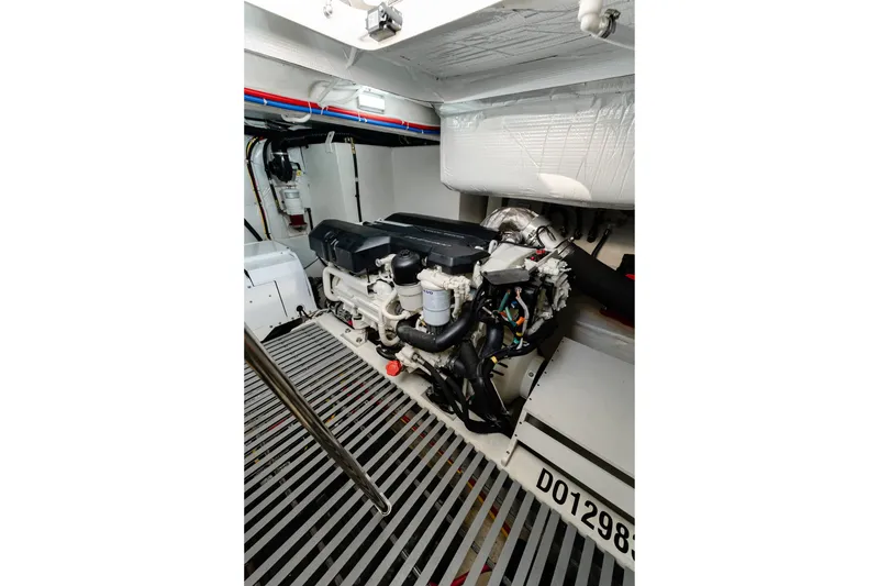 Slide: The Image of Engine room of 2020 Tiara Yachts C49 Coupe, showcasing detailed mechanical components. - 46
