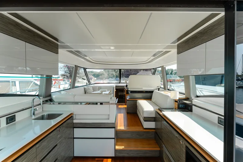 Slide: The Image of Interior of 2020 Tiara Yachts C49 Coupe, featuring modern design and luxurious seating. - 19