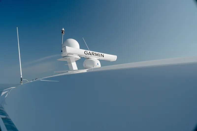 Slide: The Image of 2020 Tiara Yachts C49 Coupe with Garmin radar against clear blue sky. - 51