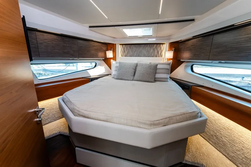 Slide: The Image of Luxurious bedroom interior of 2020 Tiara Yachts C49 Coupe with modern design and cozy bedding. - 31