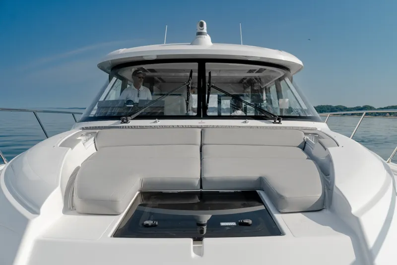 Slide: The Image of 2020 Tiara Yachts C49 Coupe with sleek design and spacious deck on calm waters. - 39