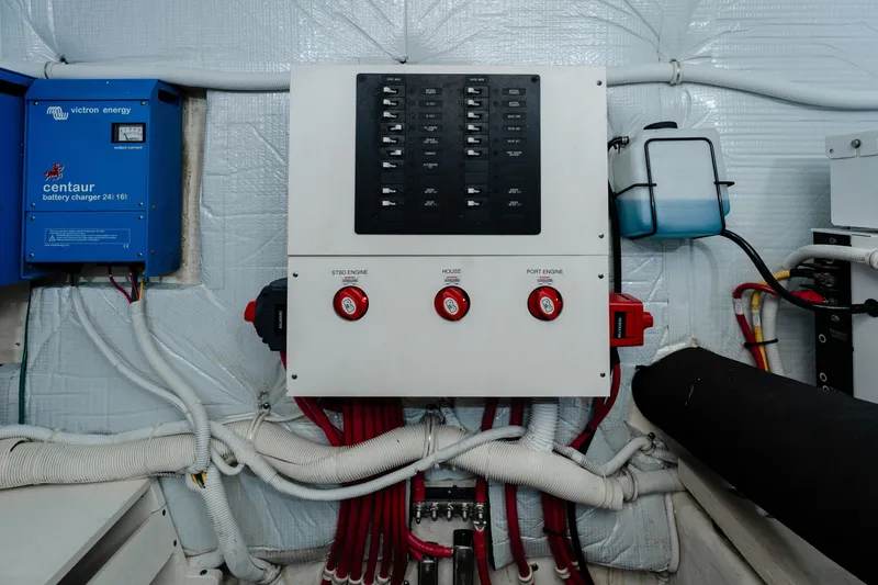 Slide: The Image of Electrical panel and battery charger in 2020 Tiara Yachts C49 Coupe engine room. - 48