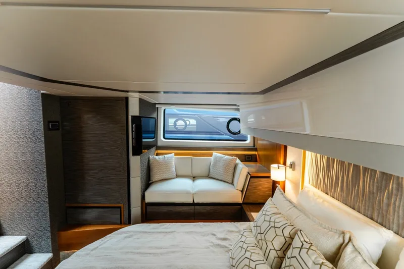 Slide: The Image of Luxurious interior of 2020 Tiara Yachts C49 Coupe with elegant seating and bedding. - 29