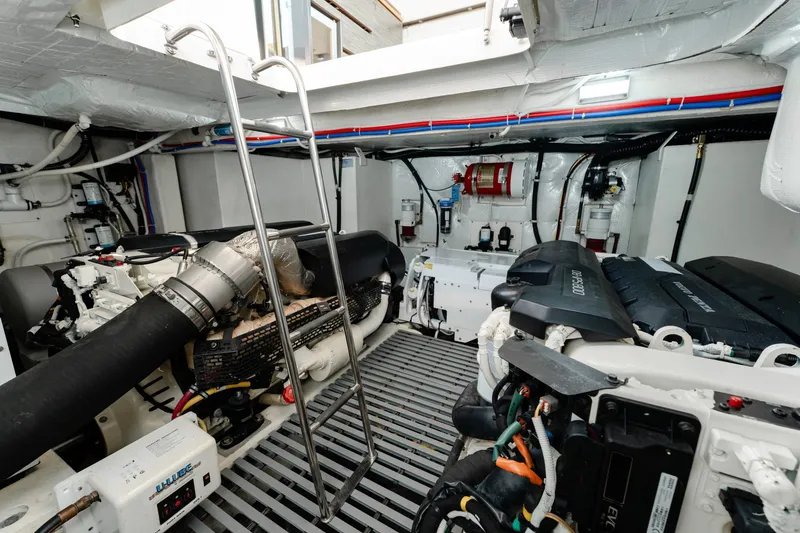 Slide: The Image of Engine room of 2020 Tiara Yachts C49 Coupe, showcasing advanced marine machinery. - 42