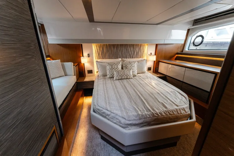 Slide: The Image of Luxurious bedroom interior of 2020 Tiara Yachts C49 Coupe with modern design and elegant furnishings. - 27