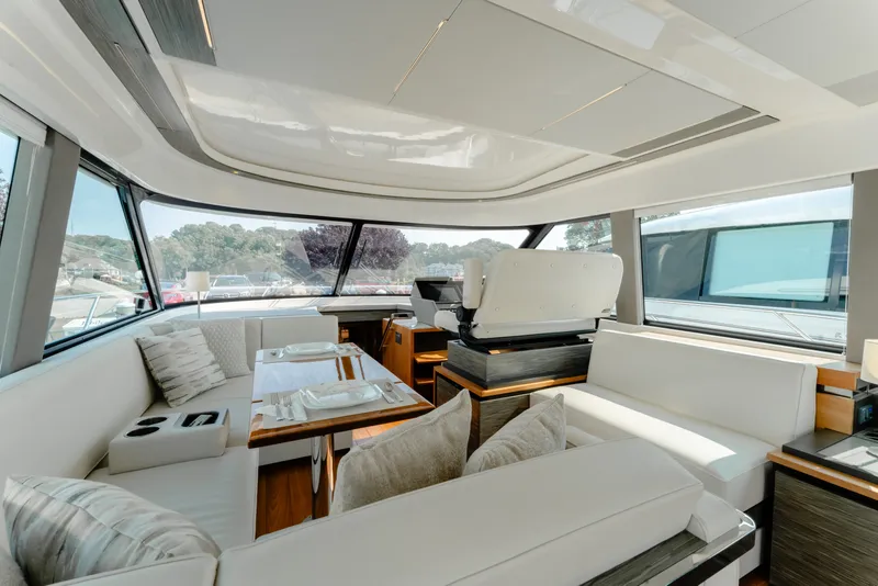 Slide: The Image of Luxurious interior of 2020 Tiara Yachts C49 Coupe with elegant seating and dining area. - 21