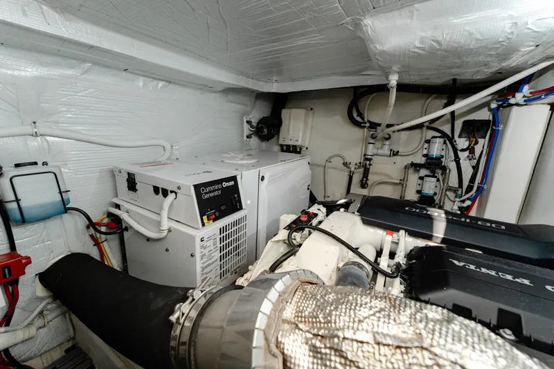 Slide: The Image of Engine room of 2020 Tiara Yachts C49 Coupe with Cummins Onan generator and Volvo Penta engine. - 45