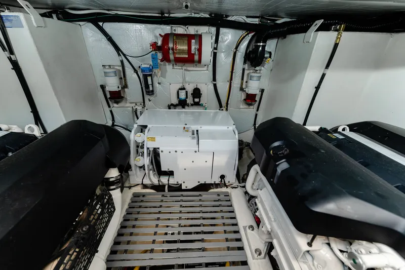 Slide: The Image of Engine room of 2020 Tiara Yachts C49 Coupe, showcasing mechanical components and systems. - 43