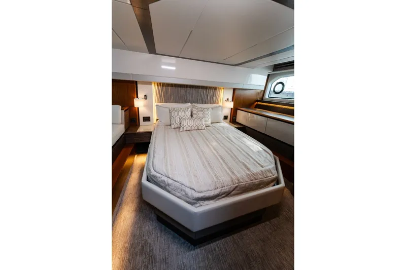 Slide: The Image of Luxurious bedroom interior of 2020 Tiara Yachts C49 Coupe with modern design and cozy bedding. - 28