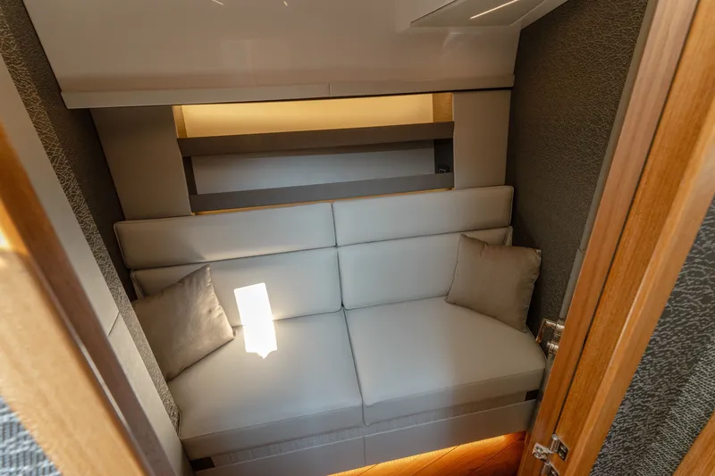 Slide: The Image of Interior cabin of 2020 Tiara Yachts C49 Coupe with plush seating and modern design. - 35