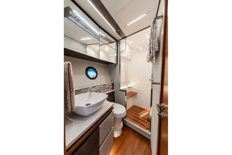 Slide: The Image of Luxurious bathroom in 2020 Tiara Yachts C49 Coupe, featuring modern fixtures and elegant design. - 34