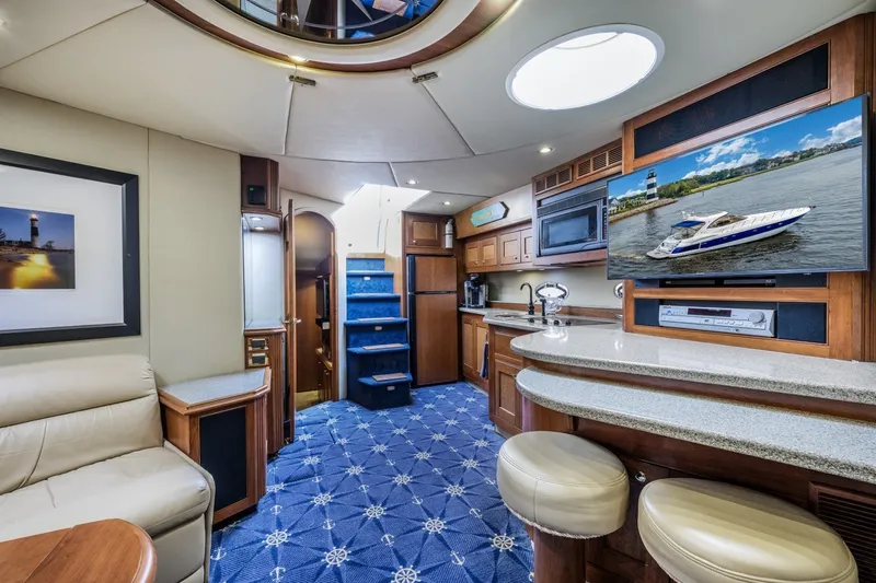 Slide: The Image of Luxurious interior of 2003 Cruisers 5470 Express yacht with modern amenities and elegant design. - 52